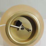 Vintage frosted glass lamp, round globe, elegant design, soft light.