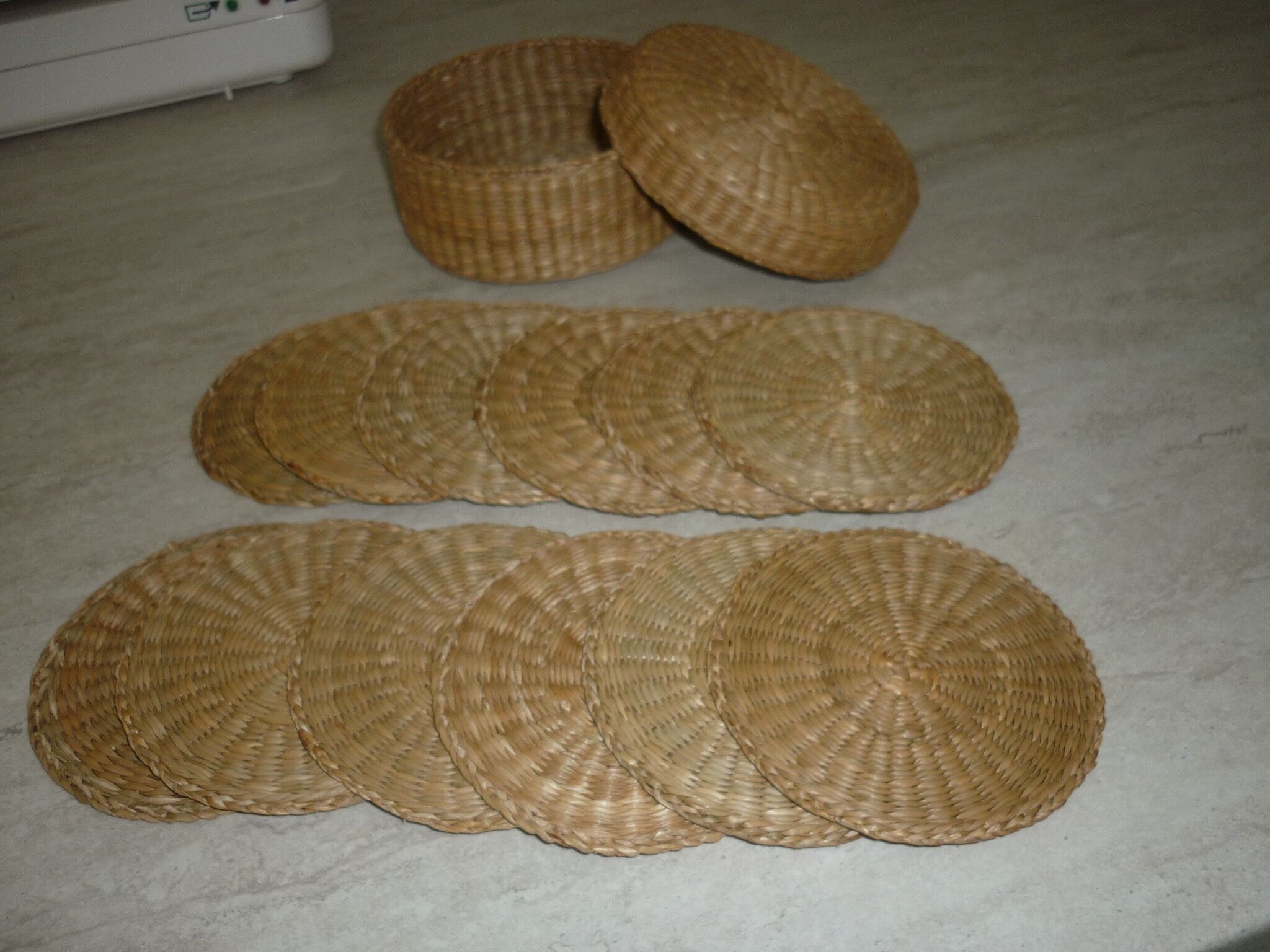 12 coasters in their wicker box