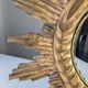 Convex sunburst mirror in carved and gilded wood, 1950s