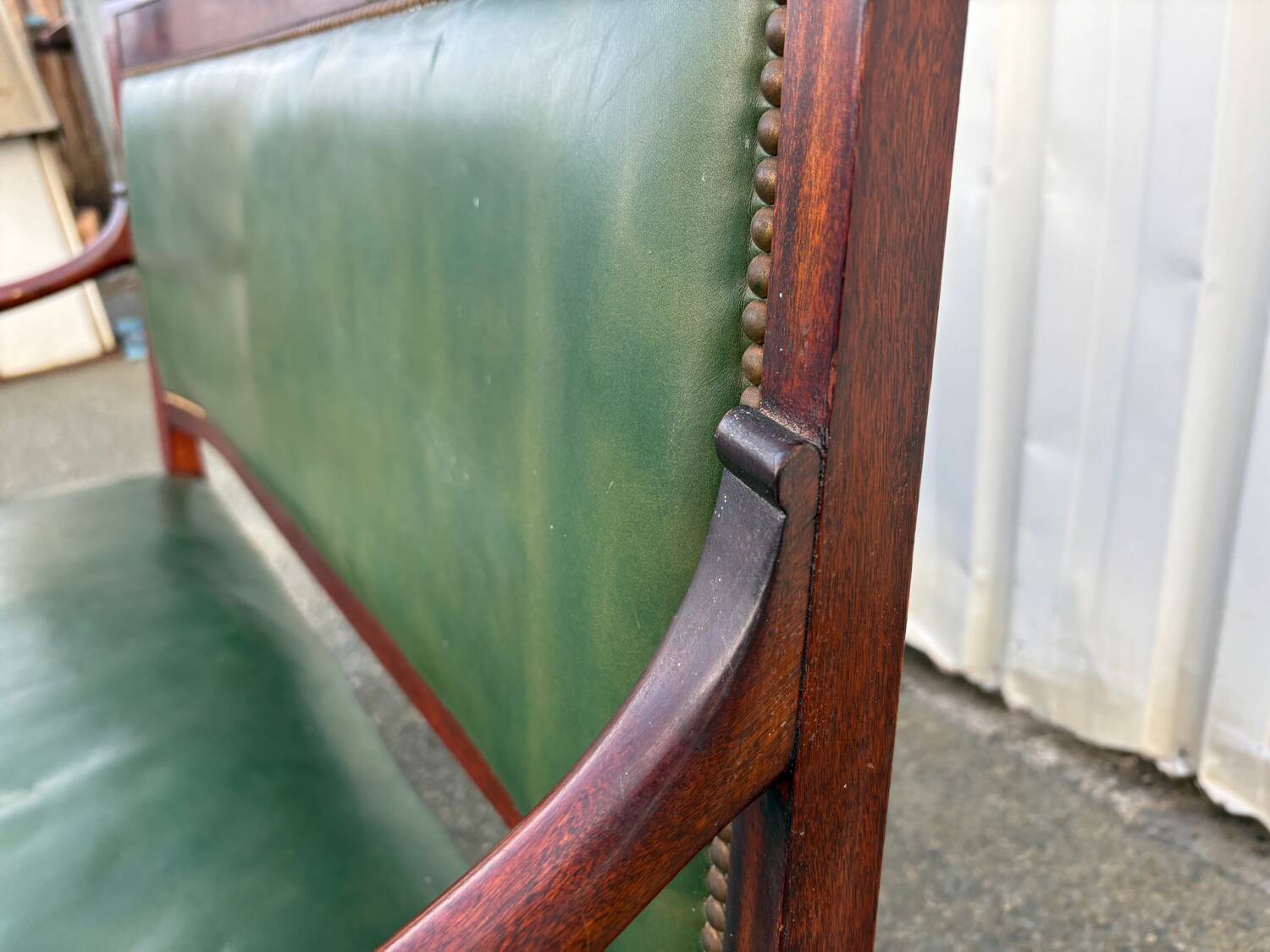Empire style bench in mahogany and green leather