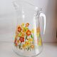 Carafe en verre à décor floral, années 70