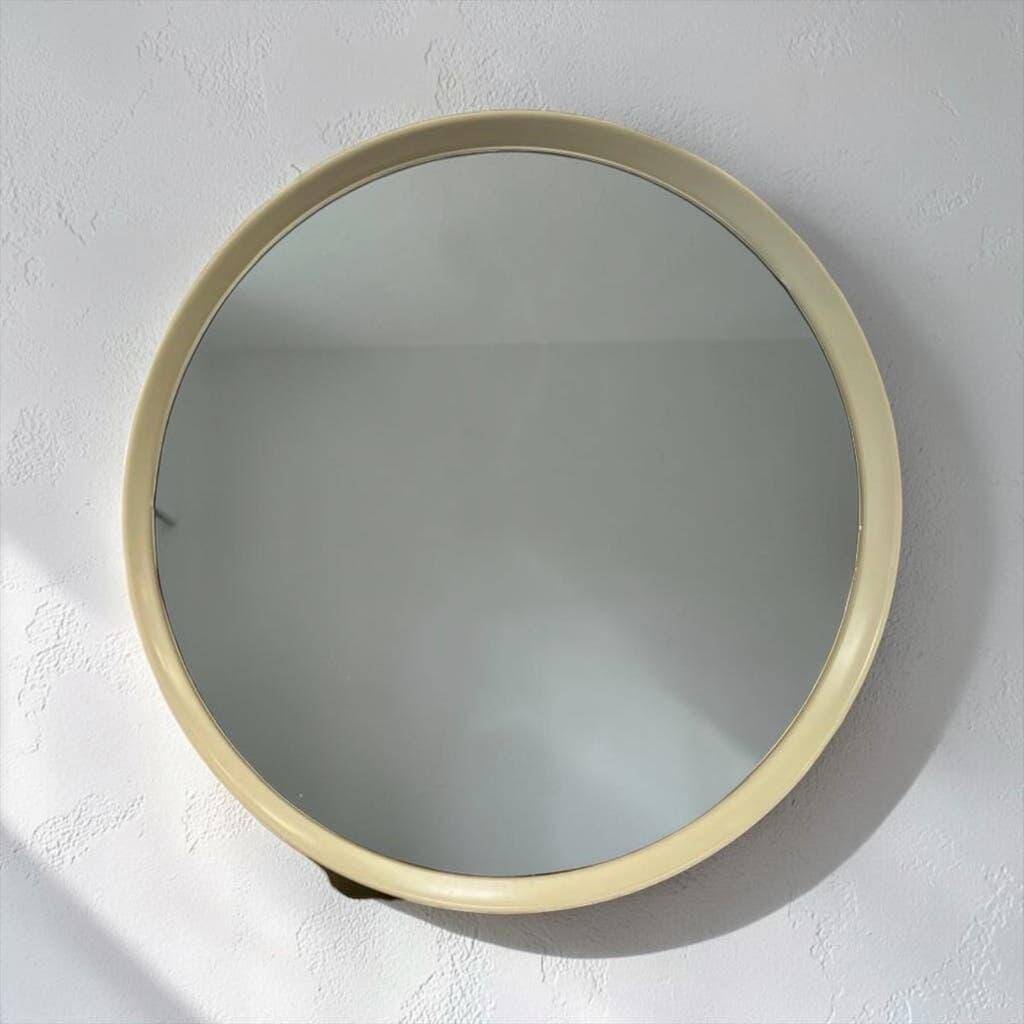 Beige vintage round mirror in a space style / wall mirror