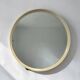 Beige vintage round mirror in a space style / wall mirror