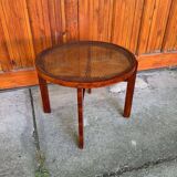 Vintage Art Deco round side table with cane top and walnut wooden frame, 1930s