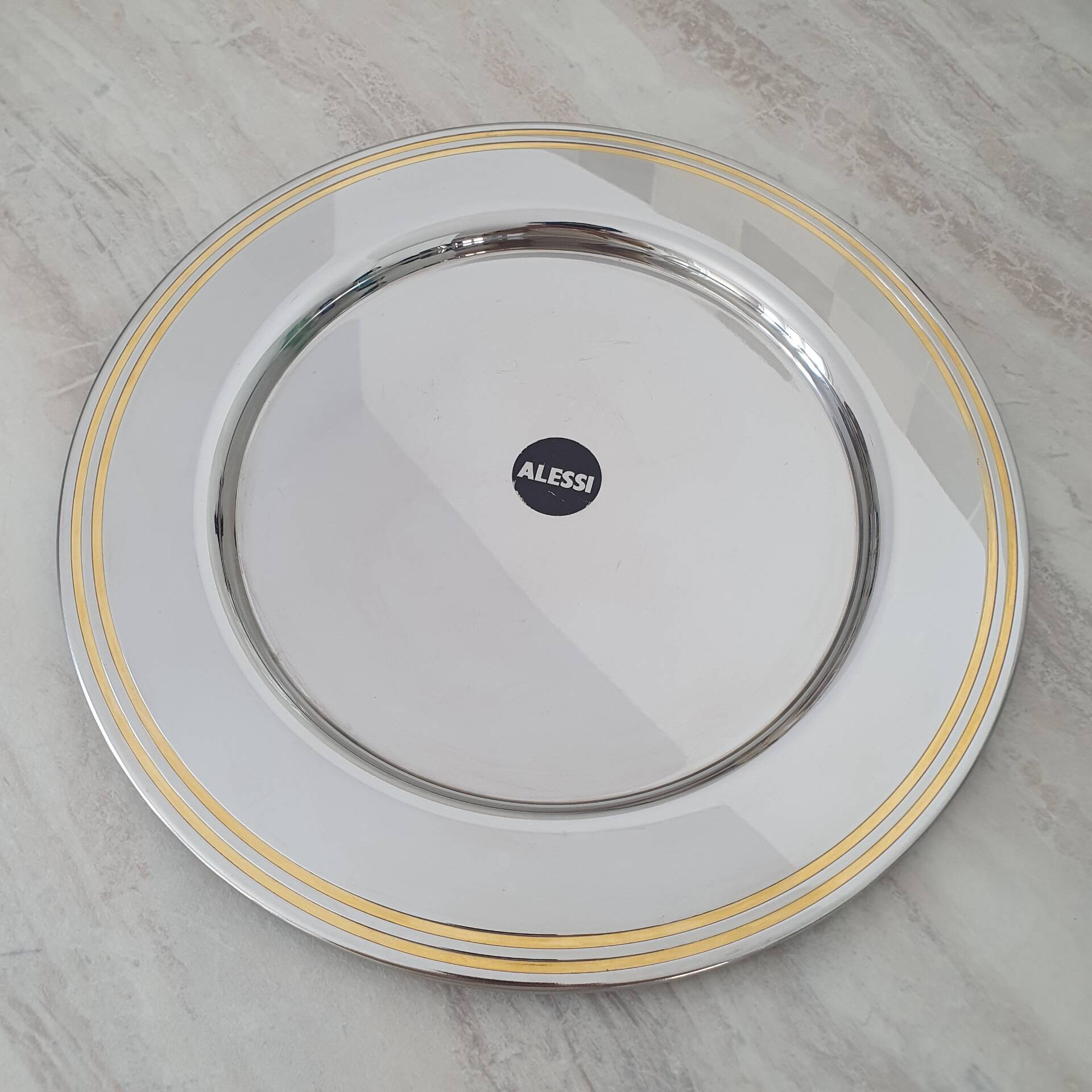 Alessi Ettore Sottsass / Serving plate in stainless steel 18/10 and gold NG5100