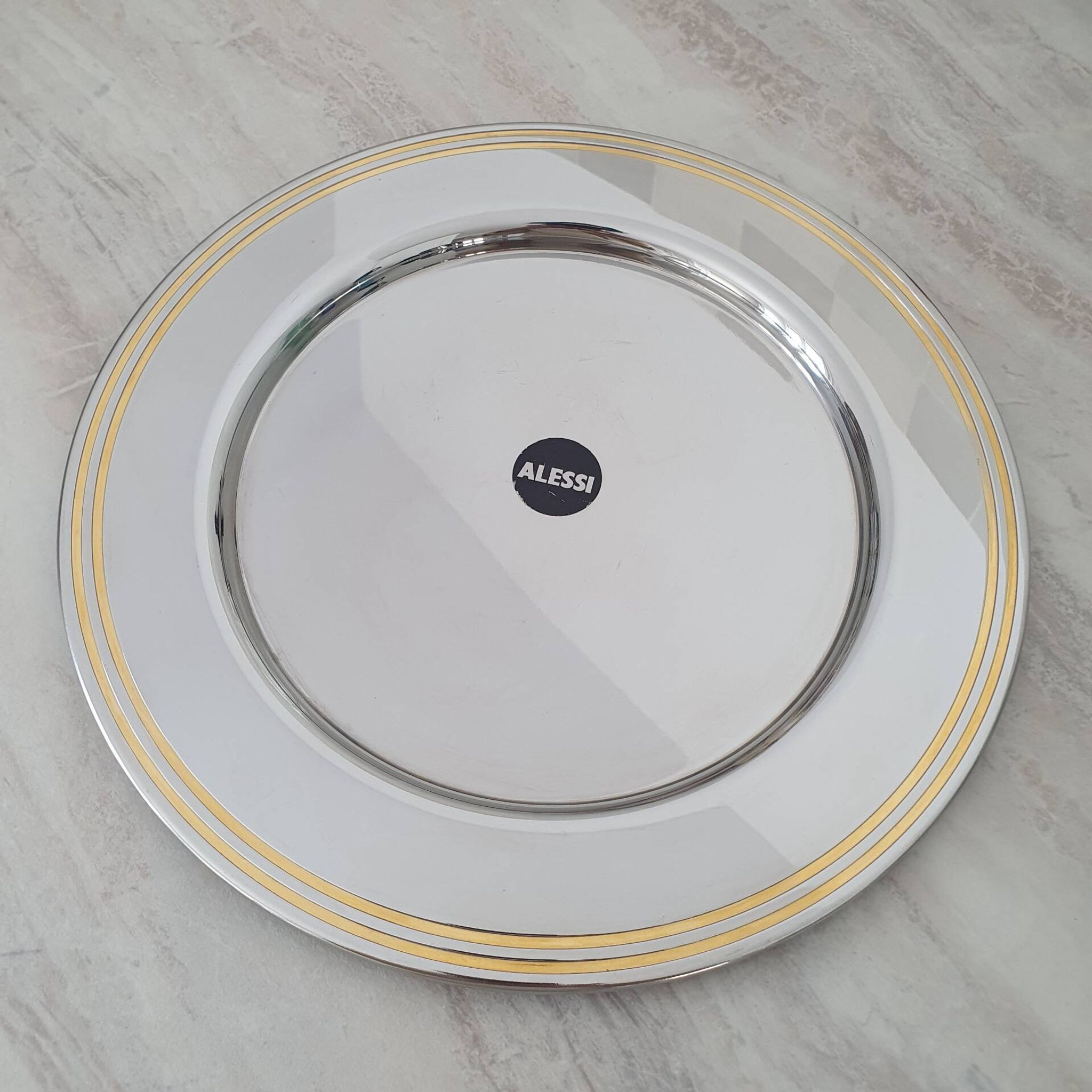 Alessi Ettore Sottsass / Serving plate in stainless steel 18/10 and gold NG5100