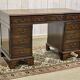English mahogany pedestal desk with leather top from the 1950s