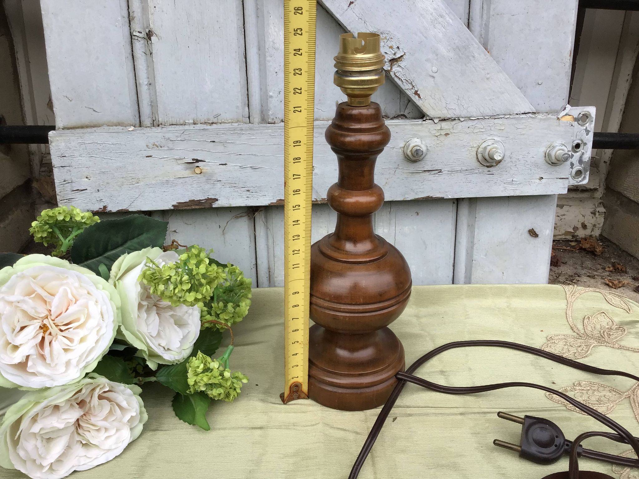 Turned wooden foot lamp with pleated lampshade