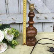 Turned wooden foot lamp with pleated lampshade