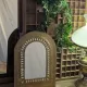 Miroir ancien doré à décor sculpté de style ethnique