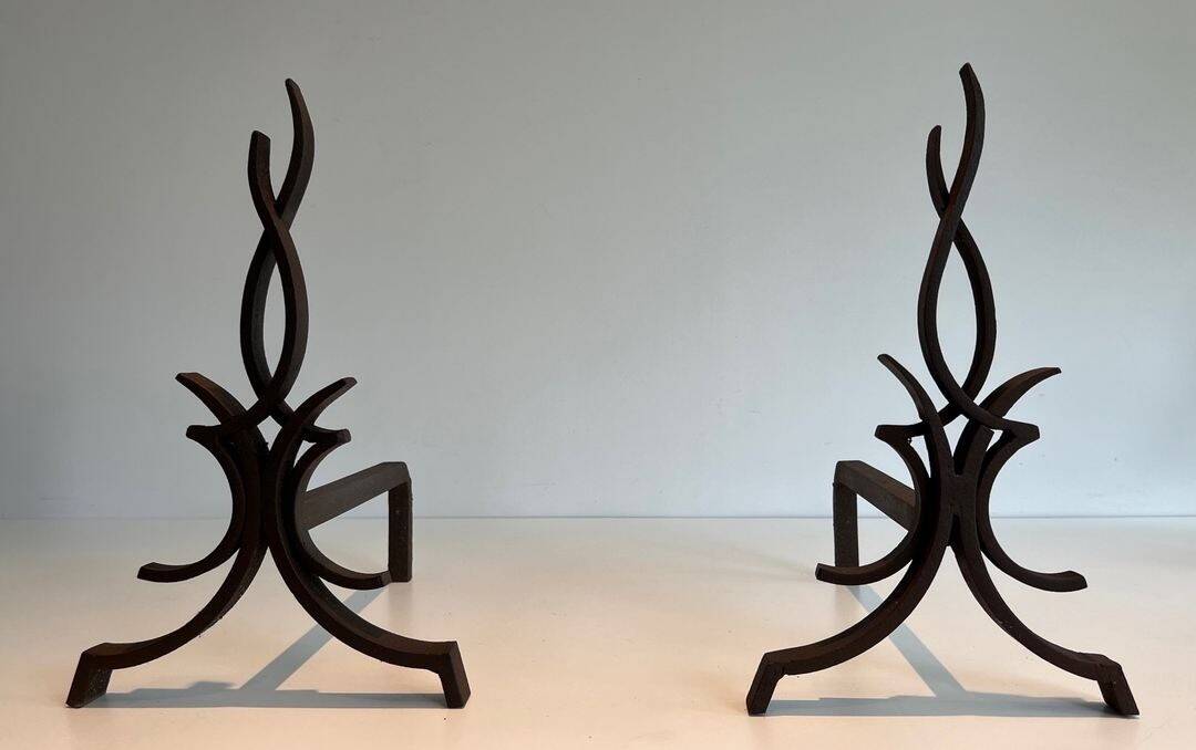 Pair of Wrought Iron Andirons with Stylised Flamboyant Uprights and Enrobed Feet
