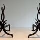 Pair of Wrought Iron Andirons with Stylised Flamboyant Uprights and Enrobed Feet