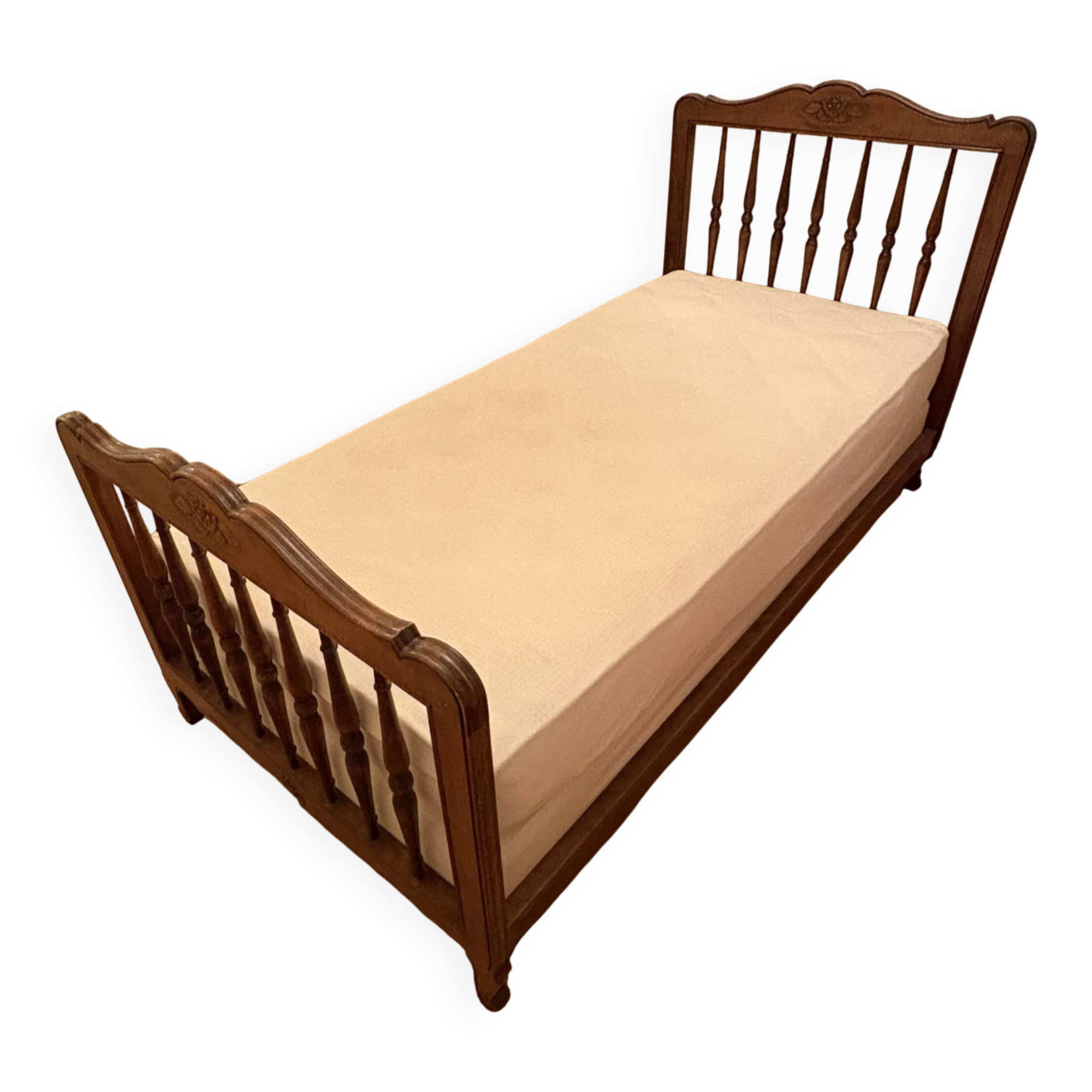 1 bed with a wooden frame and mattress