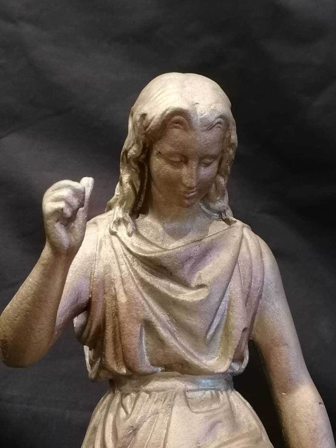 Statuette of a woman in gilded cast iron (Joan of Arc?)