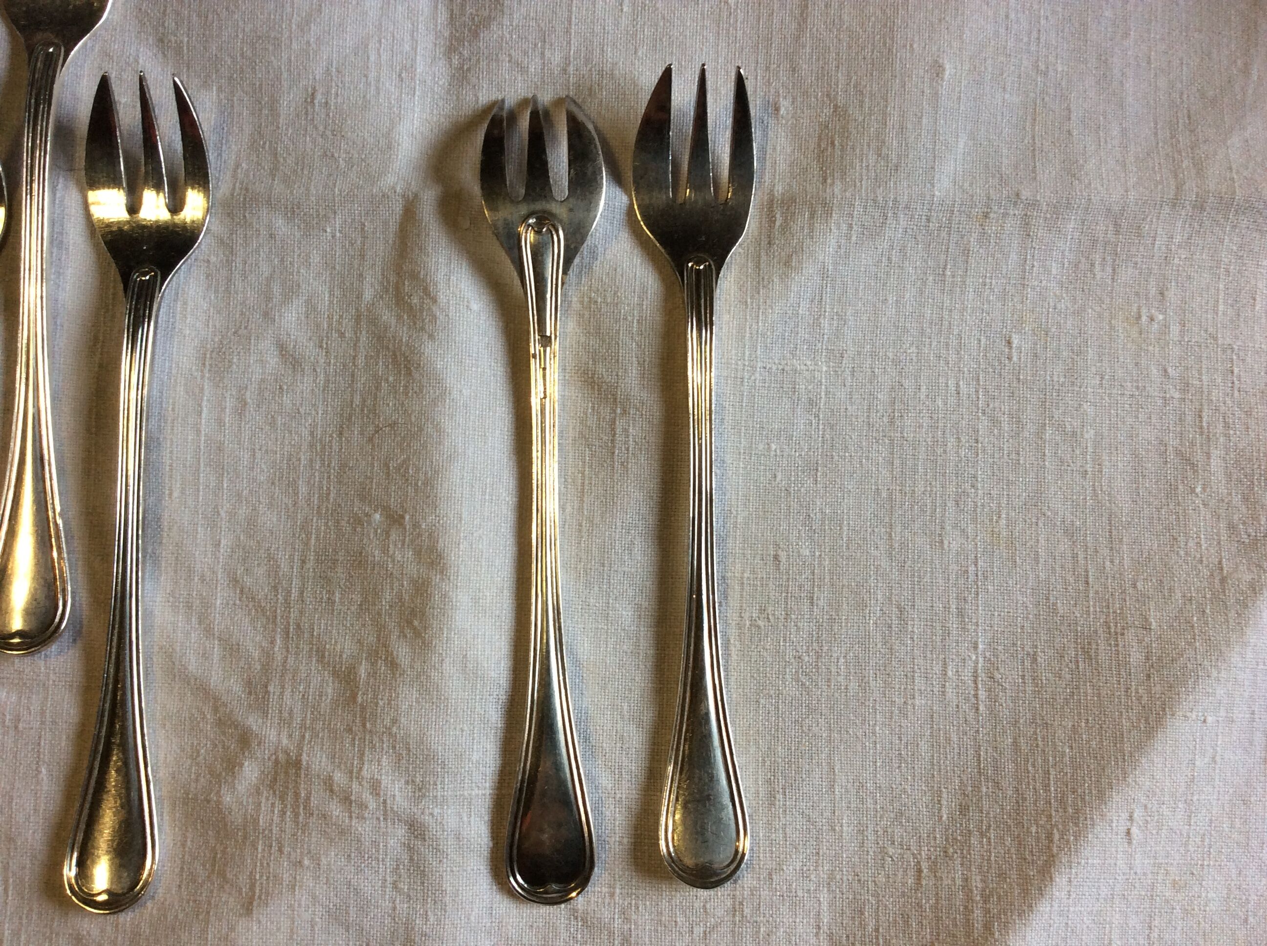 12 Christofle oyster forks in silver metal