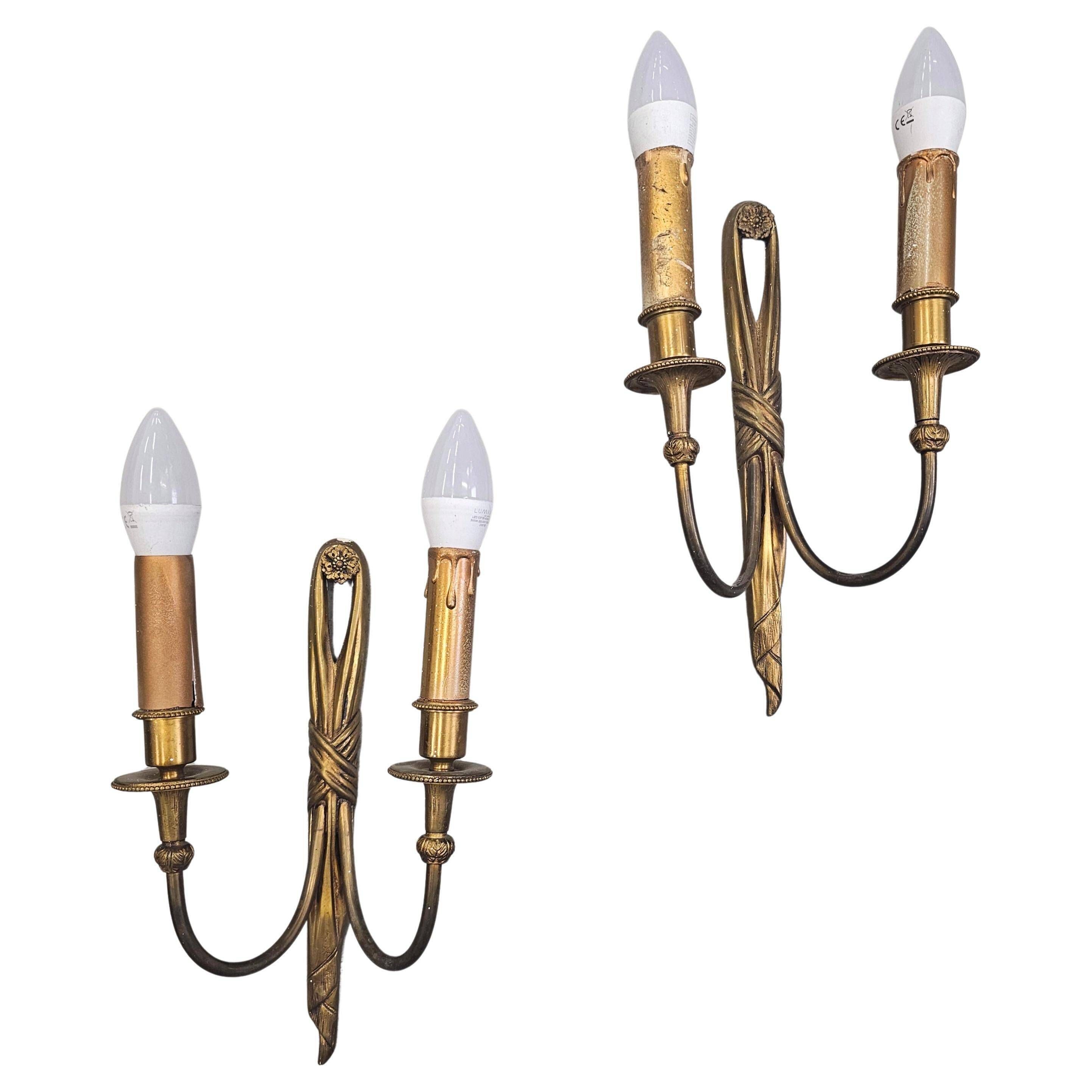 Pair of Louis XVI style bronze wall sconces with bow and tassel, 1940s.