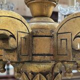 Golden wooden chandelier with crystal pendants from the 19th century.