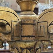 Golden wooden chandelier with crystal pendants from the 19th century.