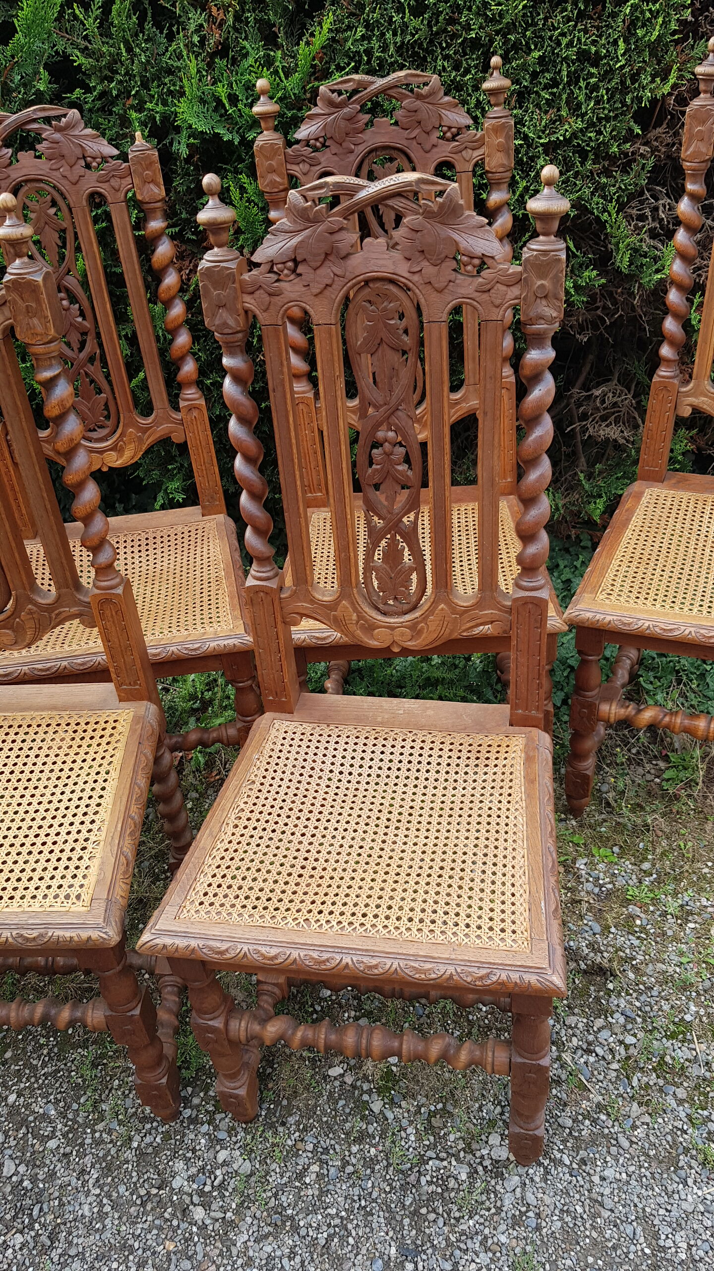 Carved antique chairs with rattan seat