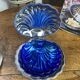 Shell-shaped butter dish in stainless steel and blue glass