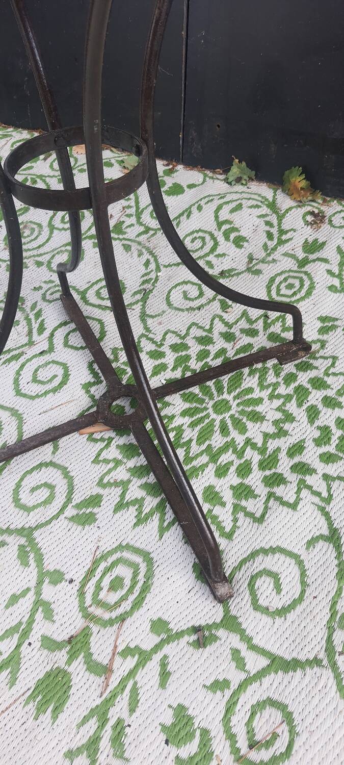 Wrought iron pedestal table