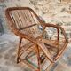 Vintage rattan lounge set, French wicker armchairs and round table, circa 1930–1950.