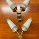 Pairs of brass sconces, ear-shaped tulips in opaline glass from the 1950s