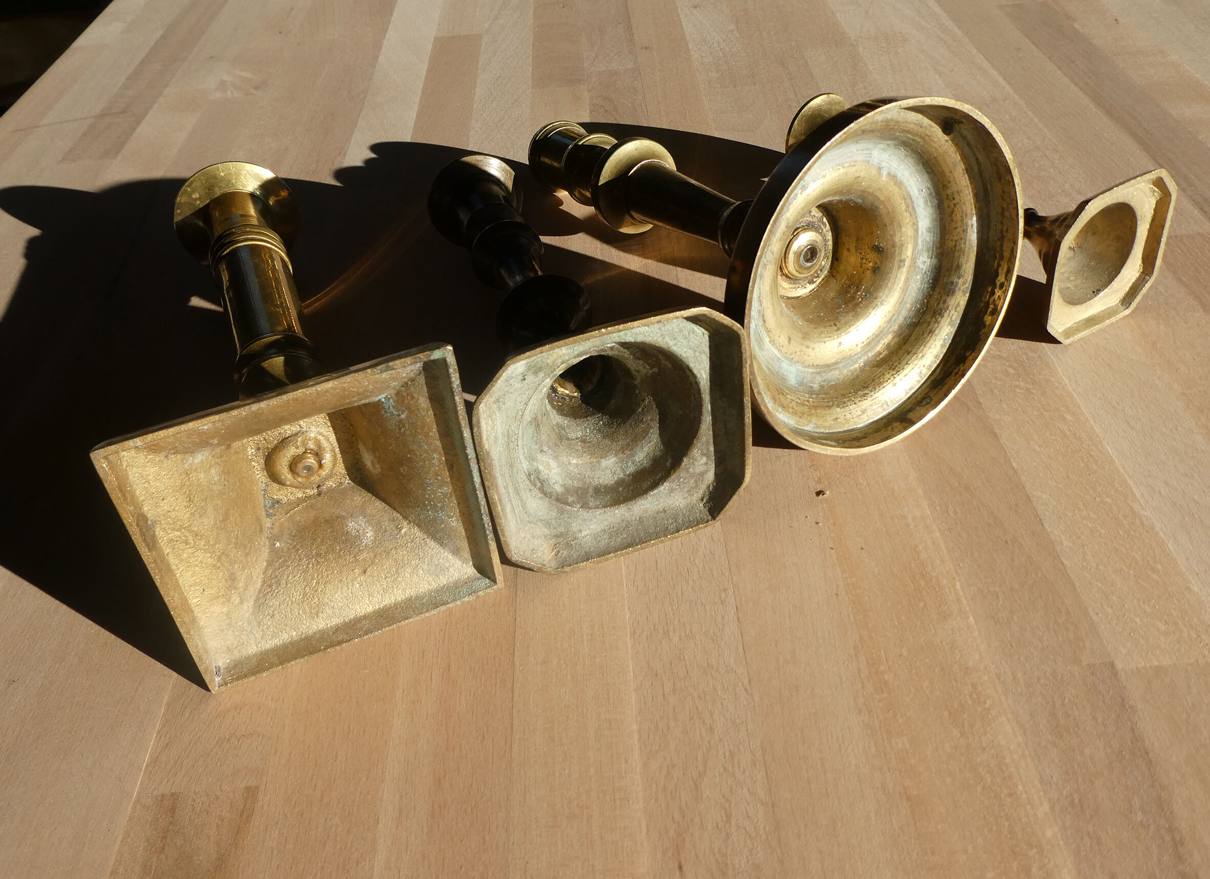 Set of 4 old candle holders in golden brass