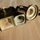 Set of 4 old candle holders in golden brass