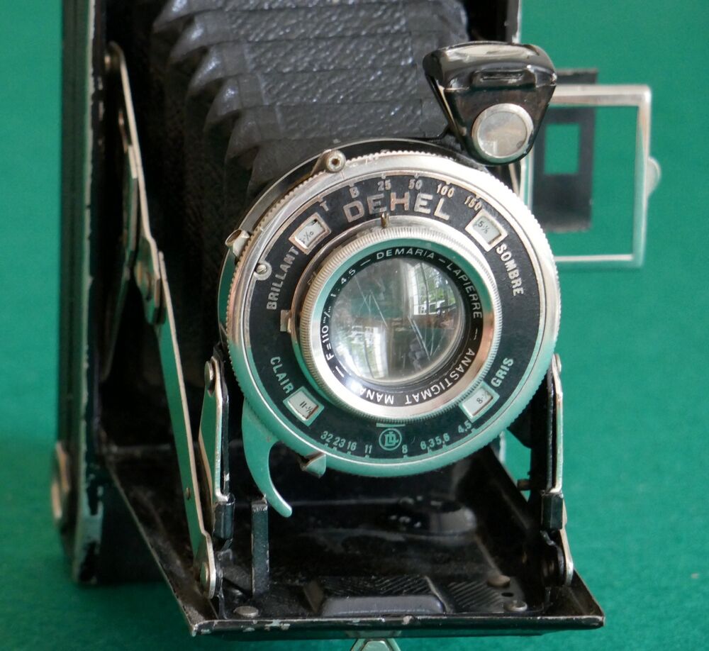 Vintage bellows camera with leather case