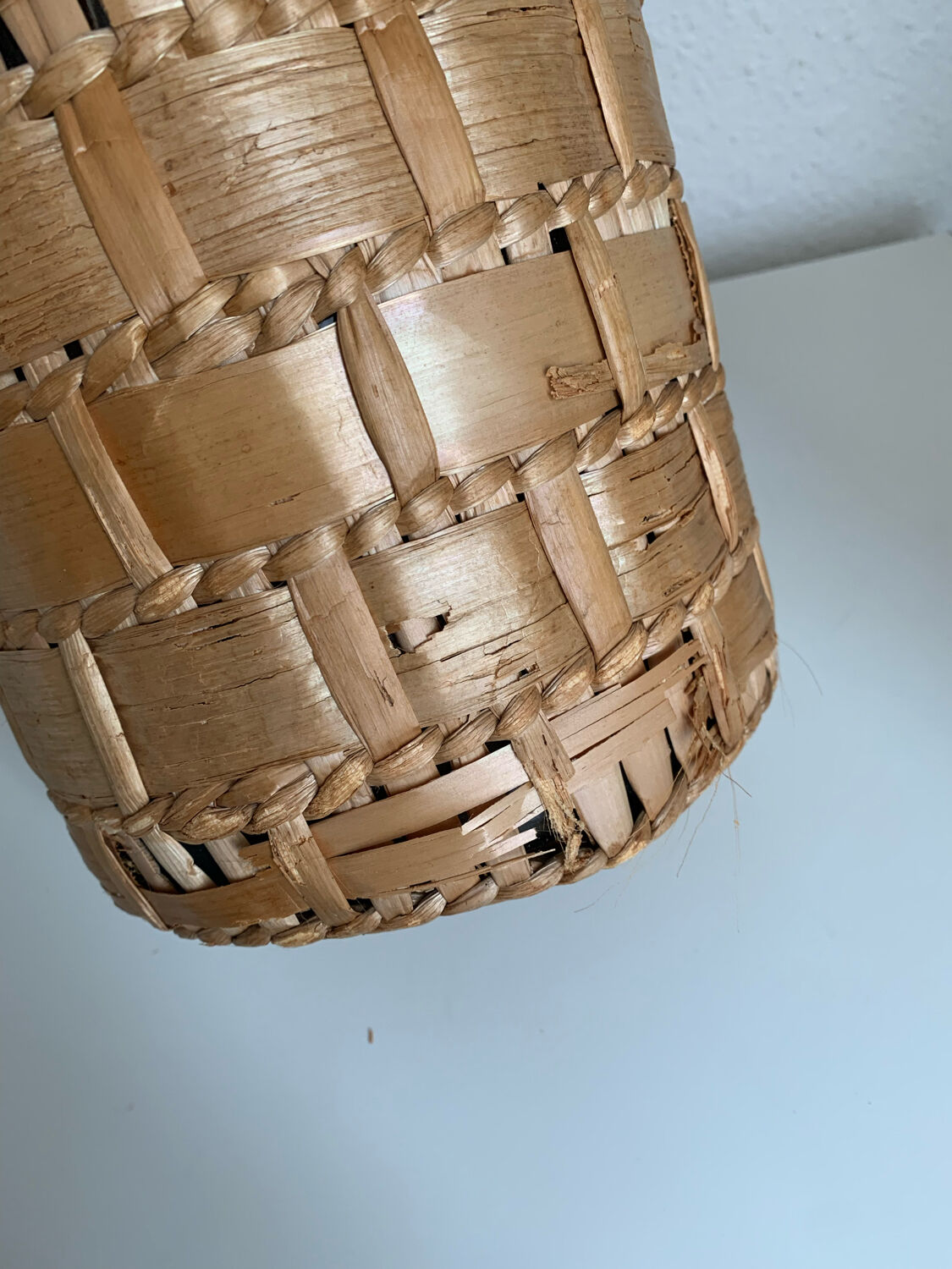 Green glass jar with wickerwork