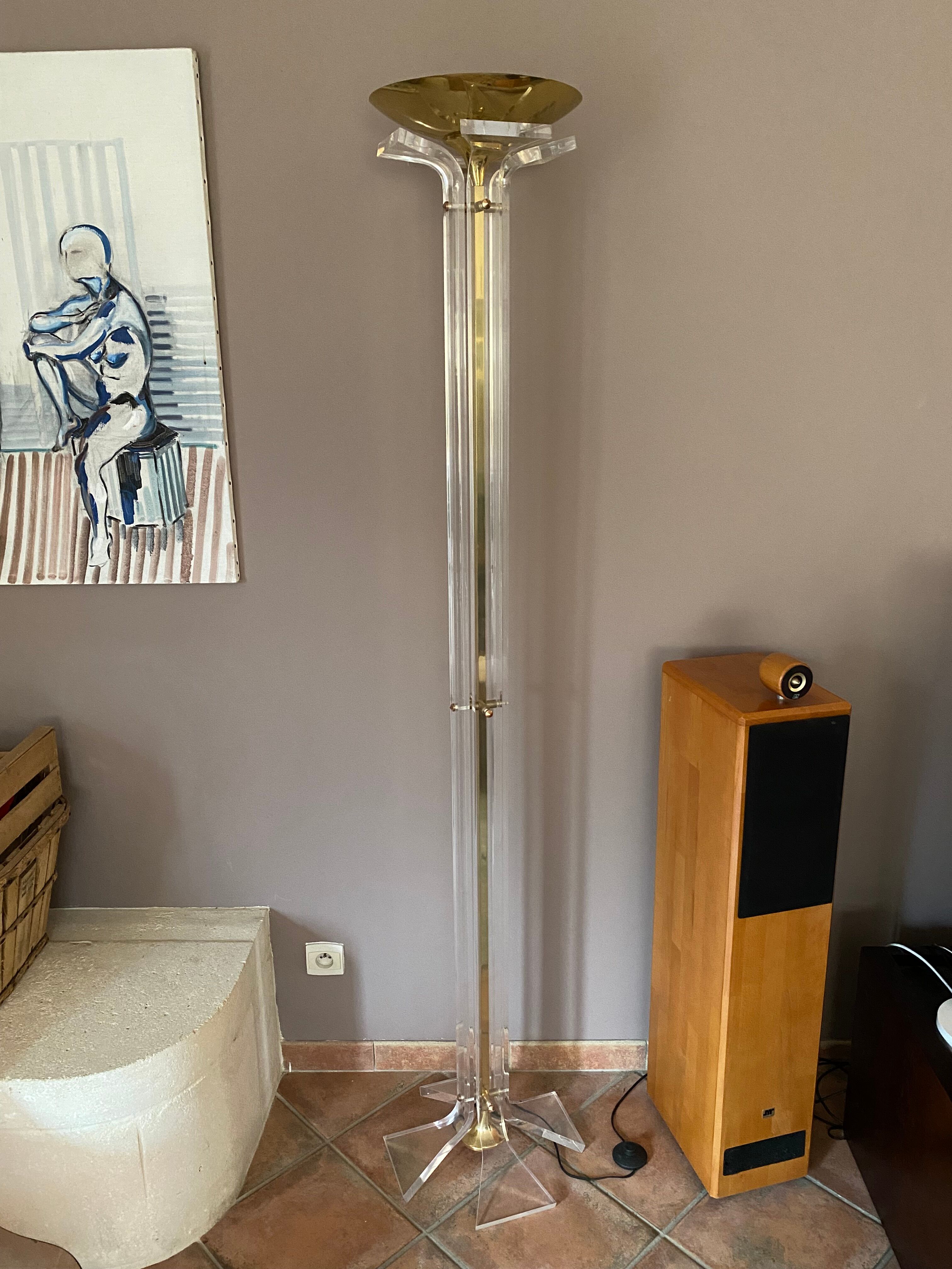 Plexiglass and brass floor lamp. 1970. Italy.