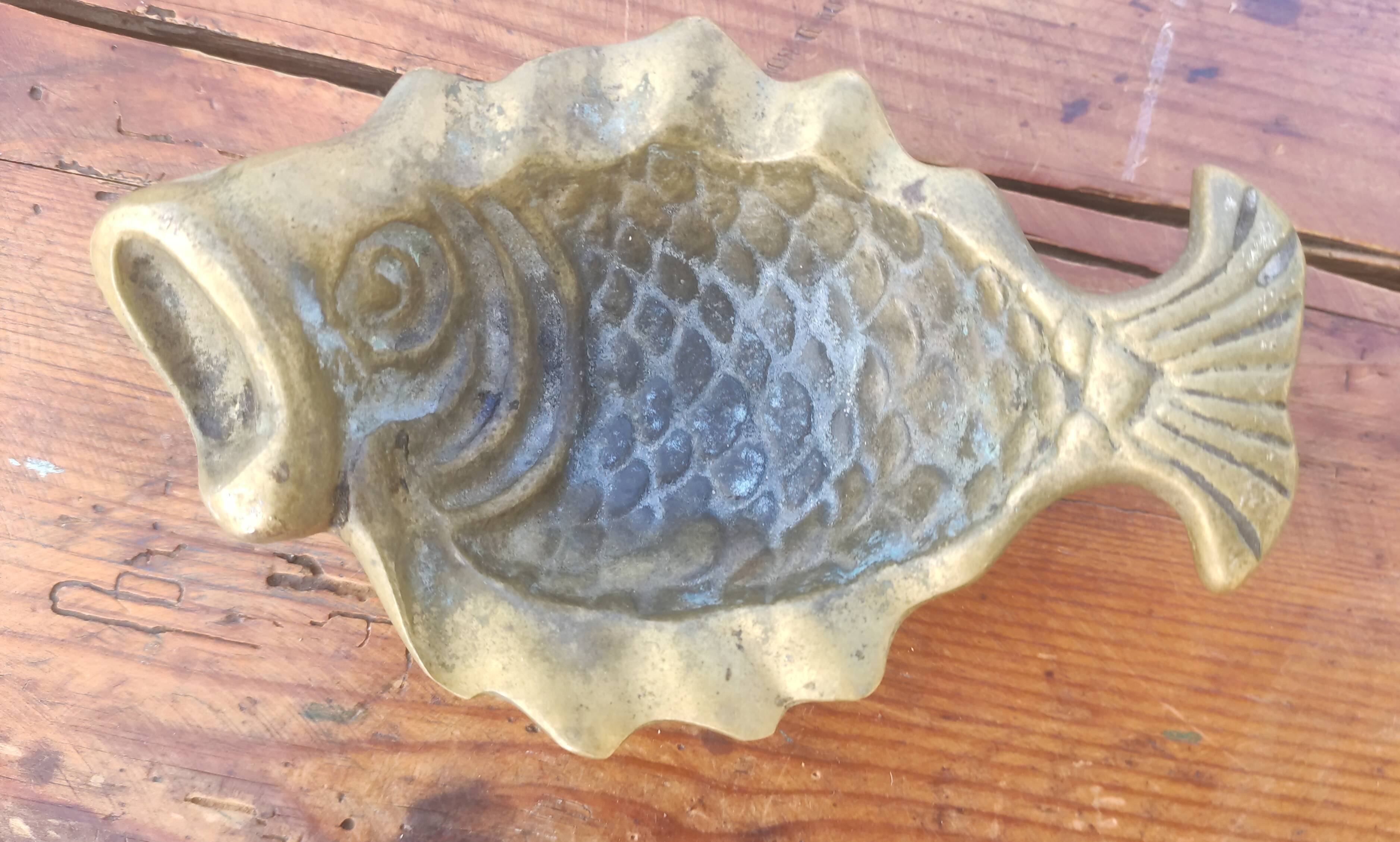 Brass fish pocket empty