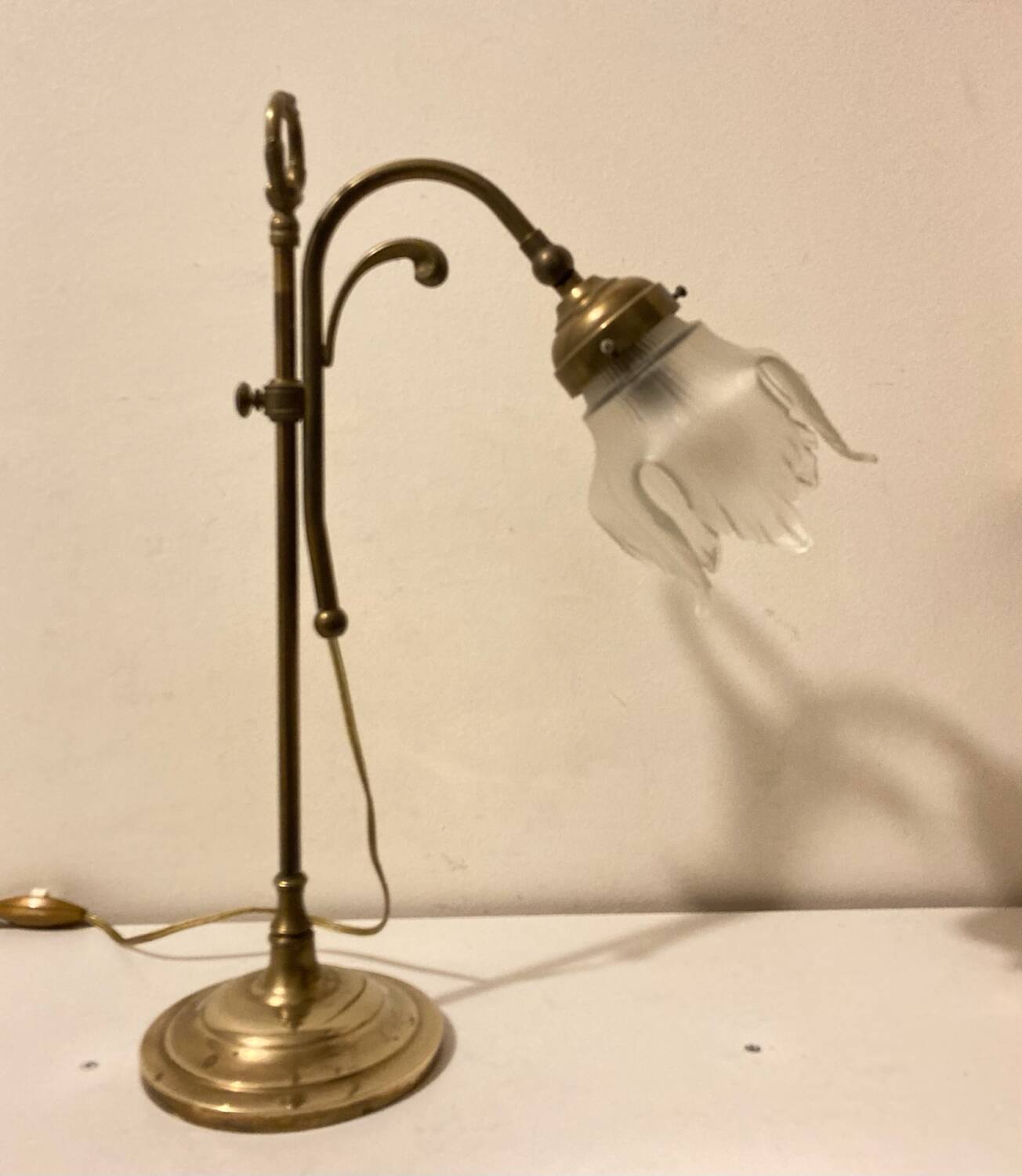 Brass table lamp with a glass shade