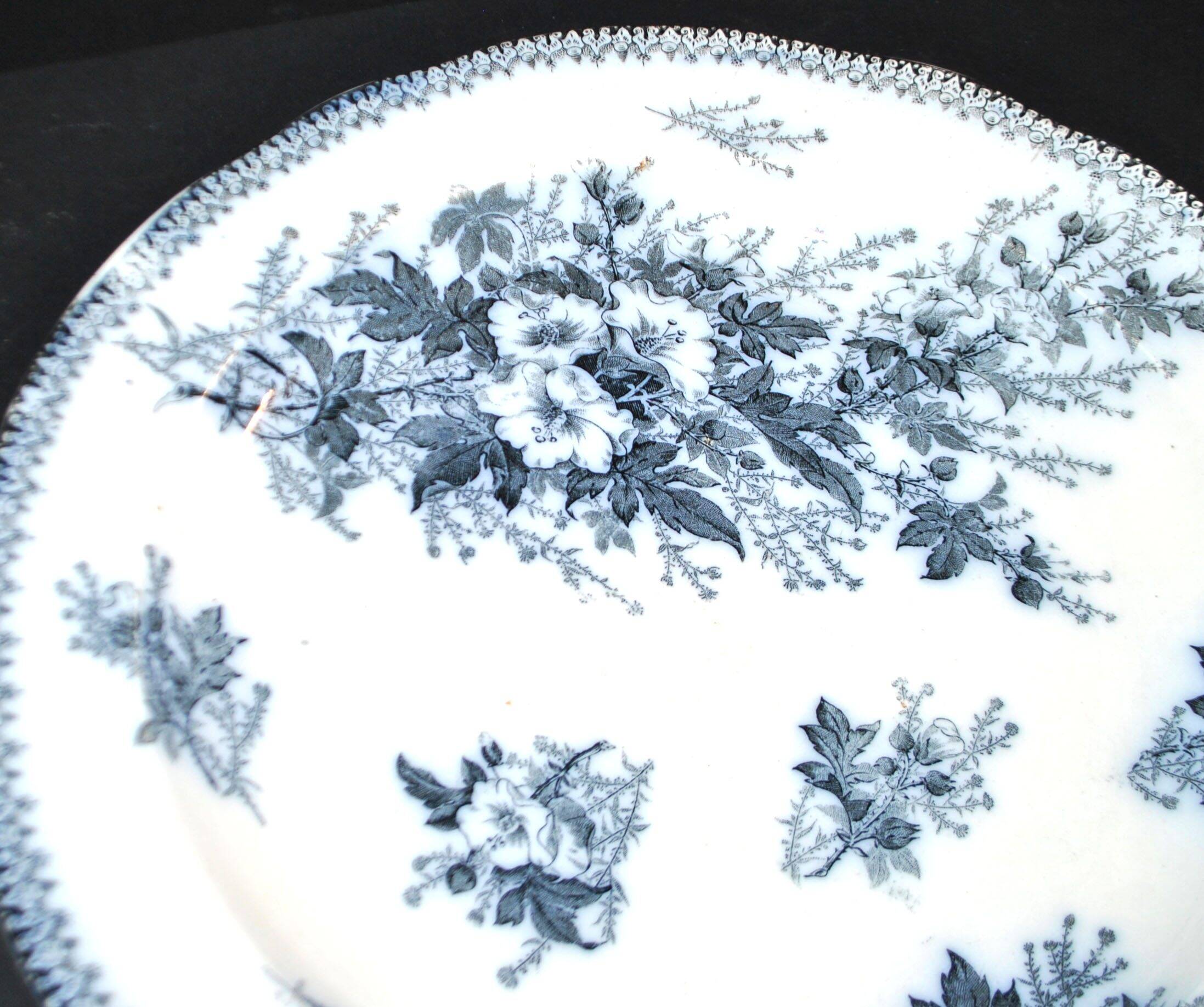 Large round antique plate with monochrome blue and black floral decoration, circa 1850.