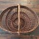 Vintage wicker basket with openwork, sun weaving and large handle.