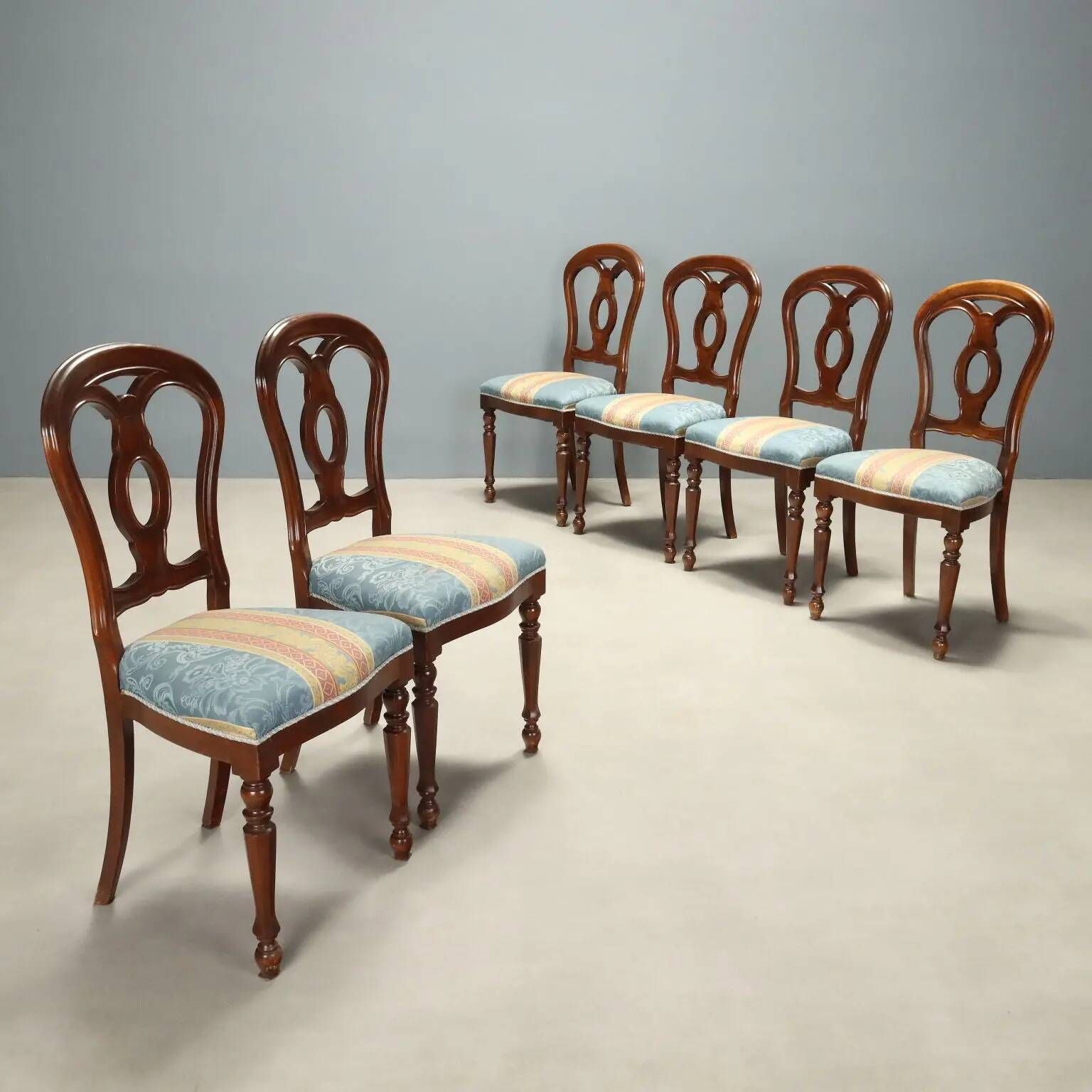 Antique walnut chairs with curved legs, Italy, mid-19th century.
