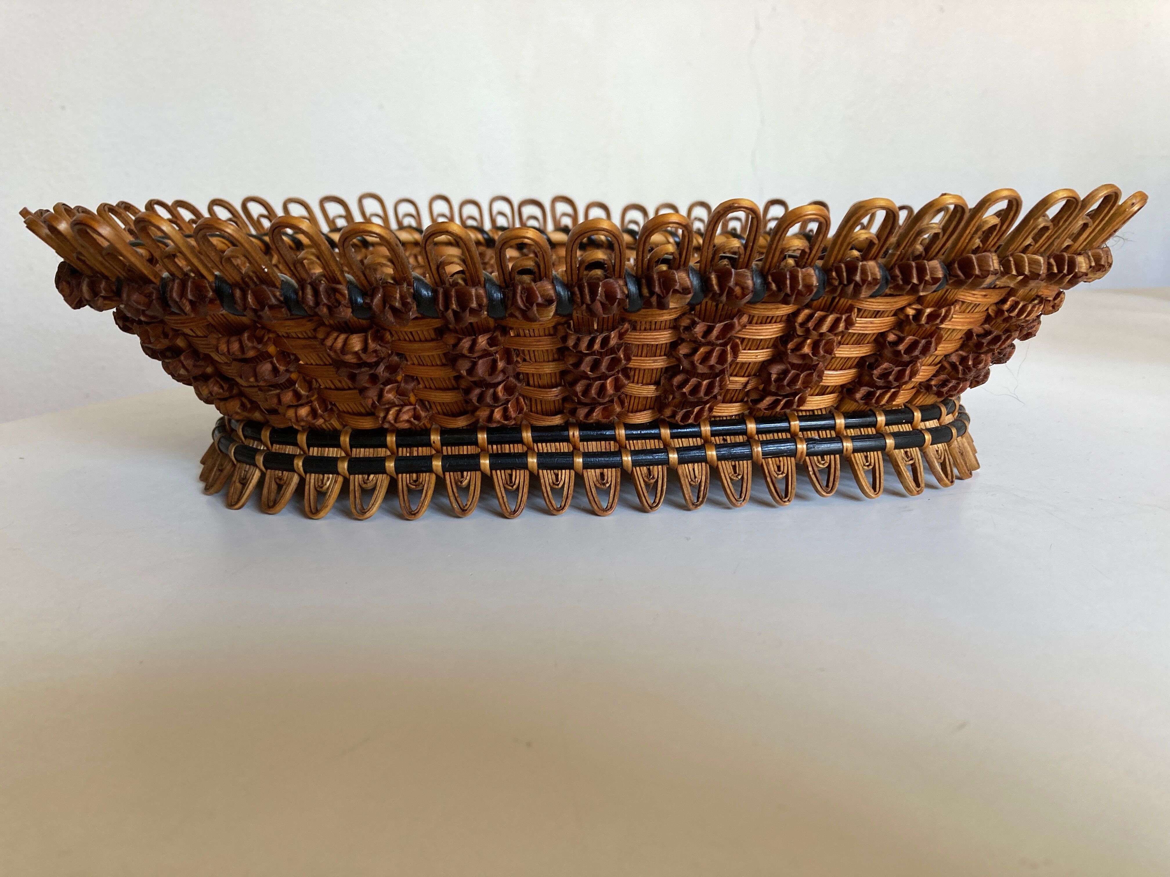 19th-century wicker basket embroidered by folk artisans.