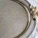 Vintage round silver metal serving tray with gold knot handles