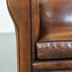 Cognac-colored sheep leather Art Deco design armchair finished with piping