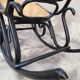 Rocking-chair noir canné bois courbé 1930