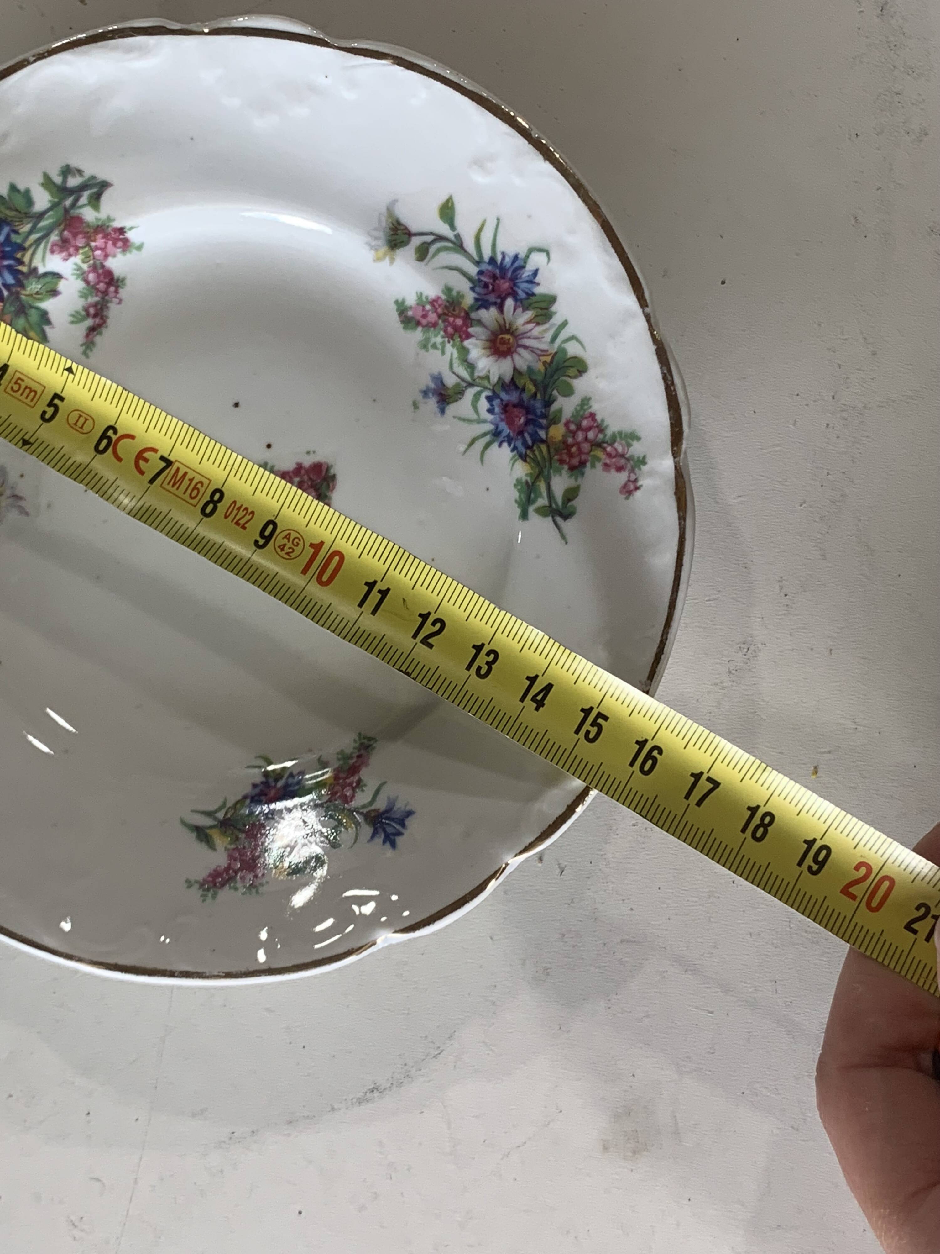 4 vintage porcelain saucers