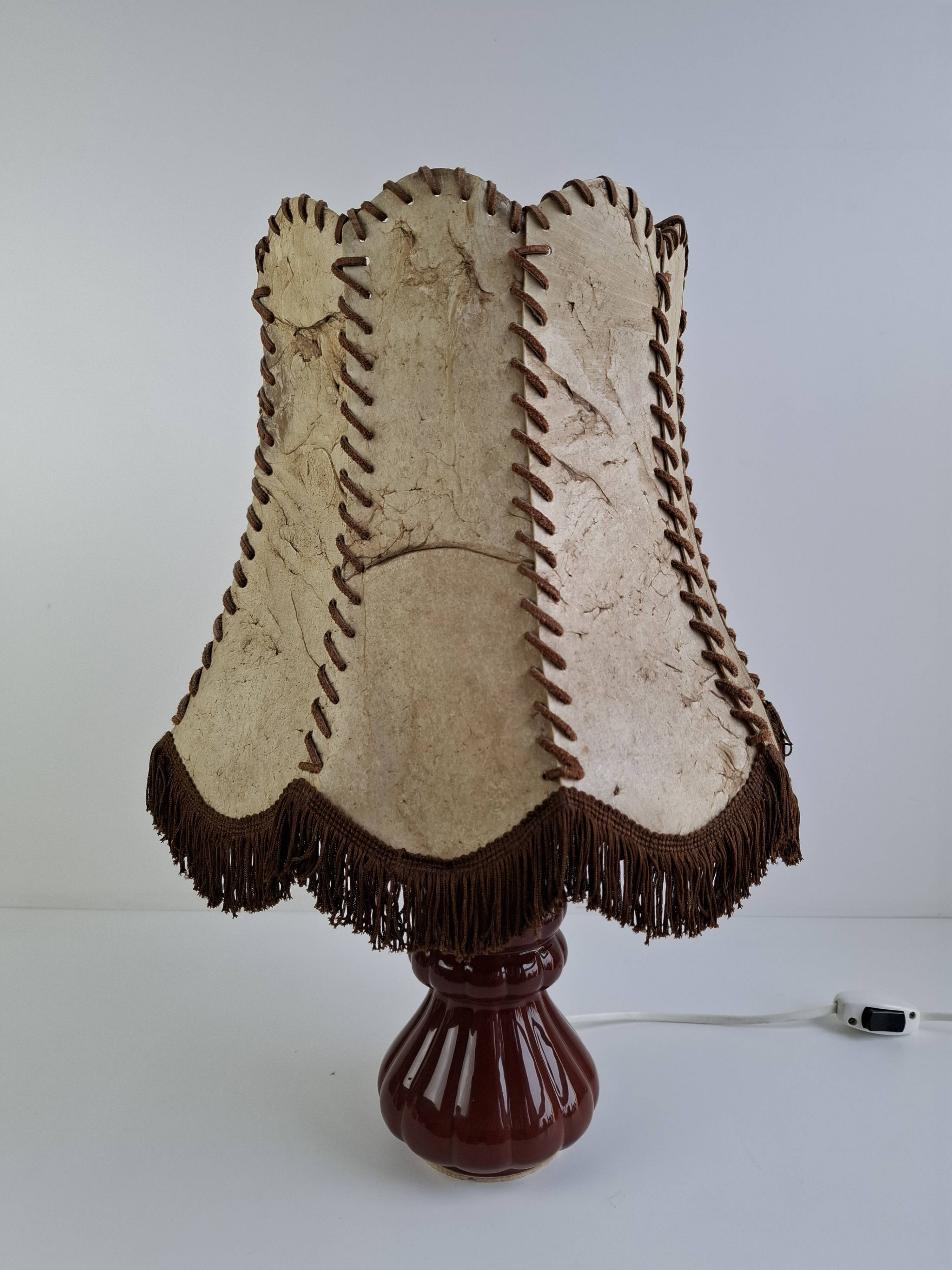 Vintage ceramic table lamp with hand-stitched leather shade, 1980s.
