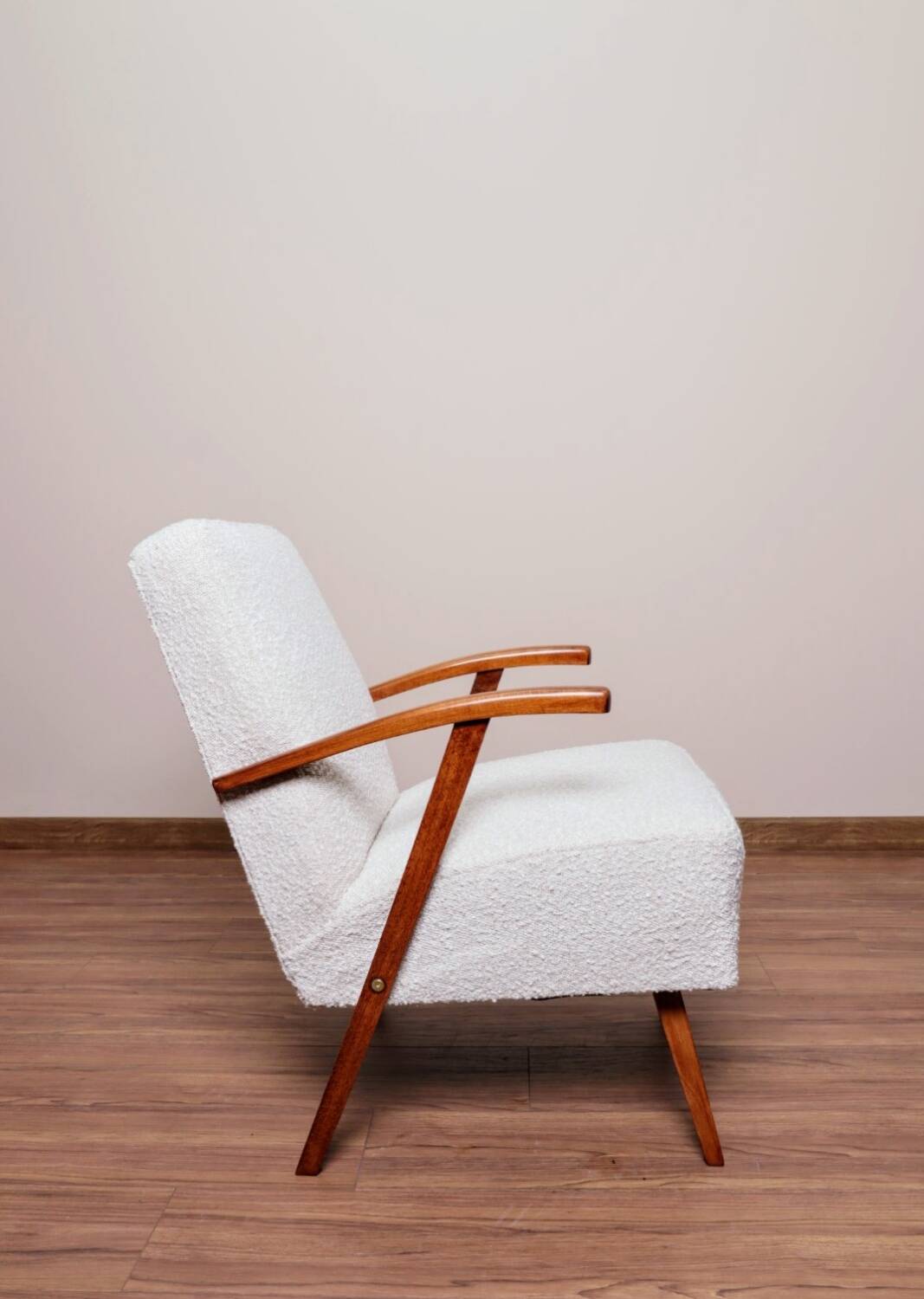 Vintage armchair in pearl bouclé, mid-century modern design from the 1960s.
