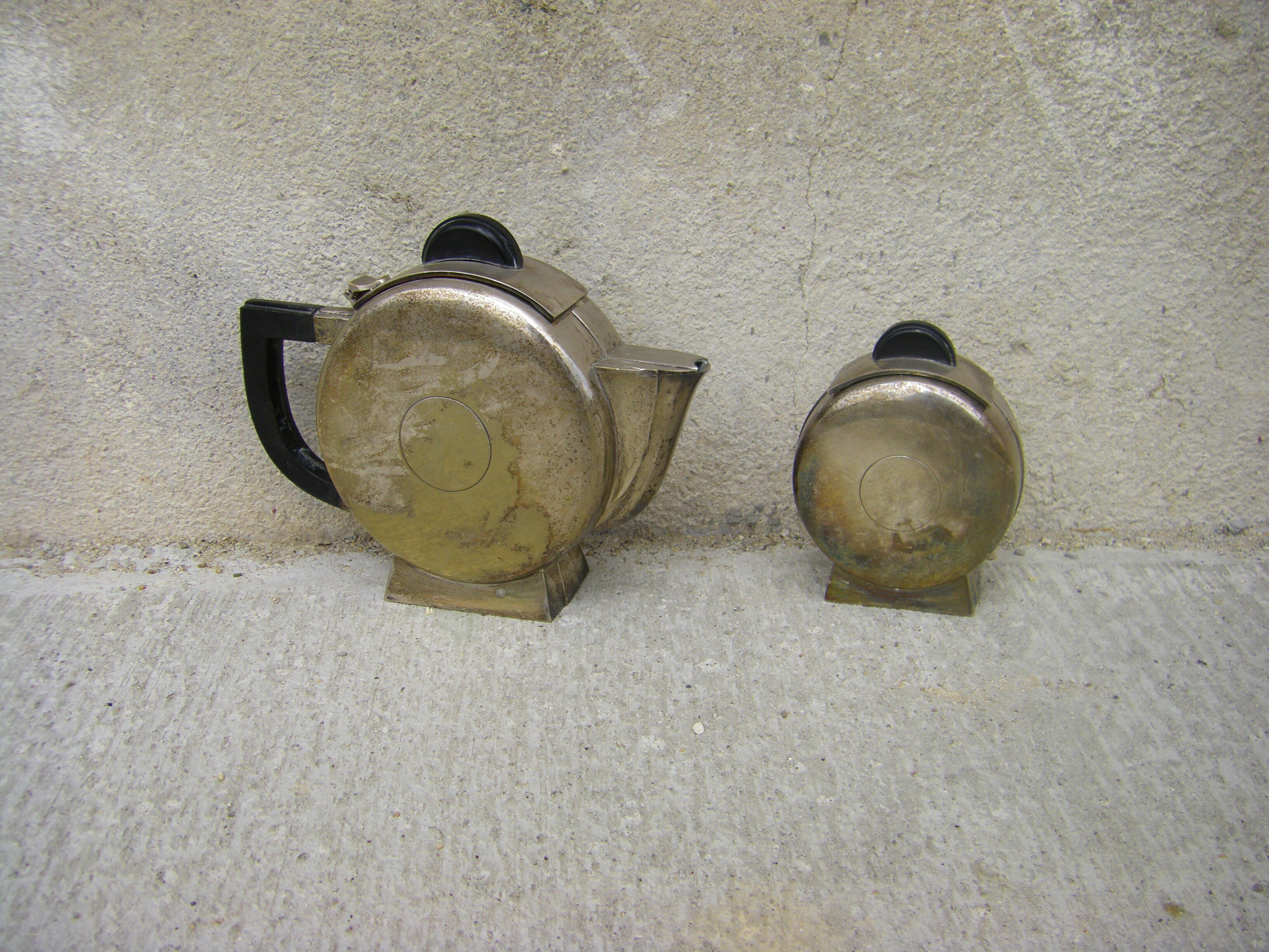 Set of a teapot and a silver metal sugar bowl