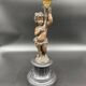 Candelabra with cherub in patinated bronze