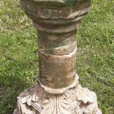 Holy water font on stone column (17th century)