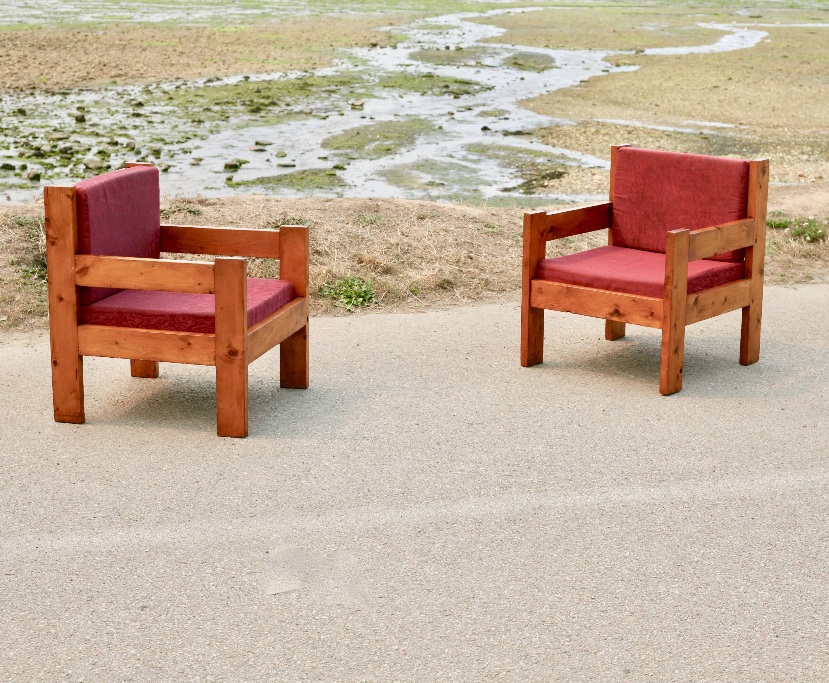 Pair of pine fireside chairs, France, 1960s, "raspberry" cushions