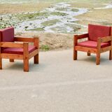 Pair of pine fireside chairs, France, 1960s, "raspberry" cushions