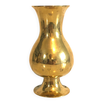 Old vase with gilded brass foot
